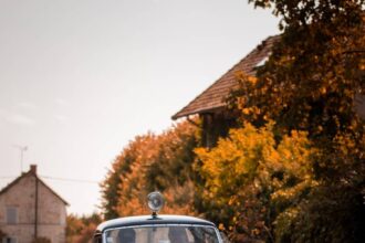 blue classic car on road during daytime