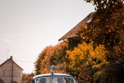 blue classic car on road during daytime
